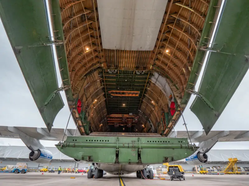 "Photograph showing the interior of the cargo hold of an Antonov 124 cargo plane taken from the rear.