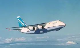 Antonov An-124 . The heavy cargo aircraft is seen soaring through the sky, its four engines propelling it forward.