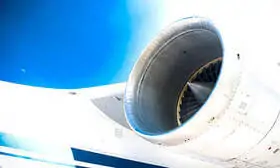 The image depicts the massive size and power of the engine, which is a key component of the Antonov 124's ability to carry heavy and oversized cargo.