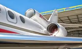 The graphic presents DASSAULT FALCON 50 powerful engines with smooth curves to the shiny metallic finish