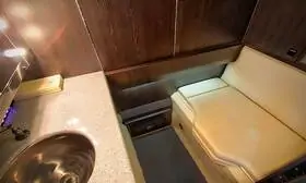 Sky N Jet DASSAULT FALCON 50 lavatory is equipped with a spacious sink, vanity mirror, and ample storage space