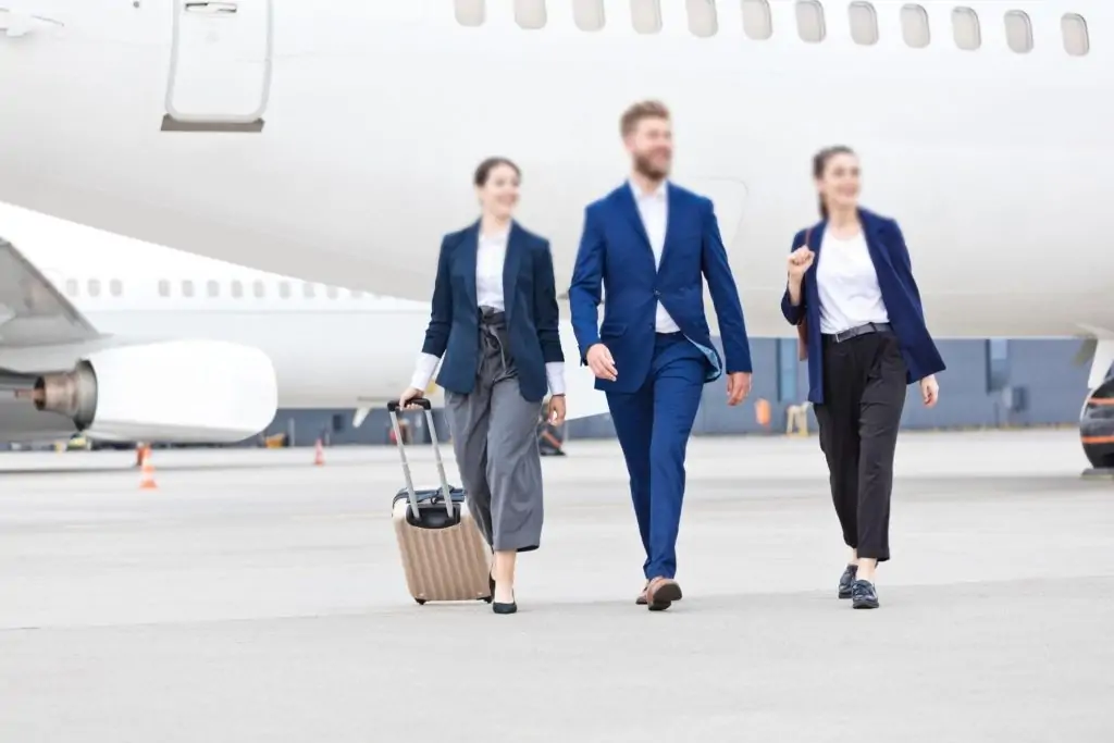 Sky N Jet's commercial team getting out of an aircraft and walking with travel bags with confidence.