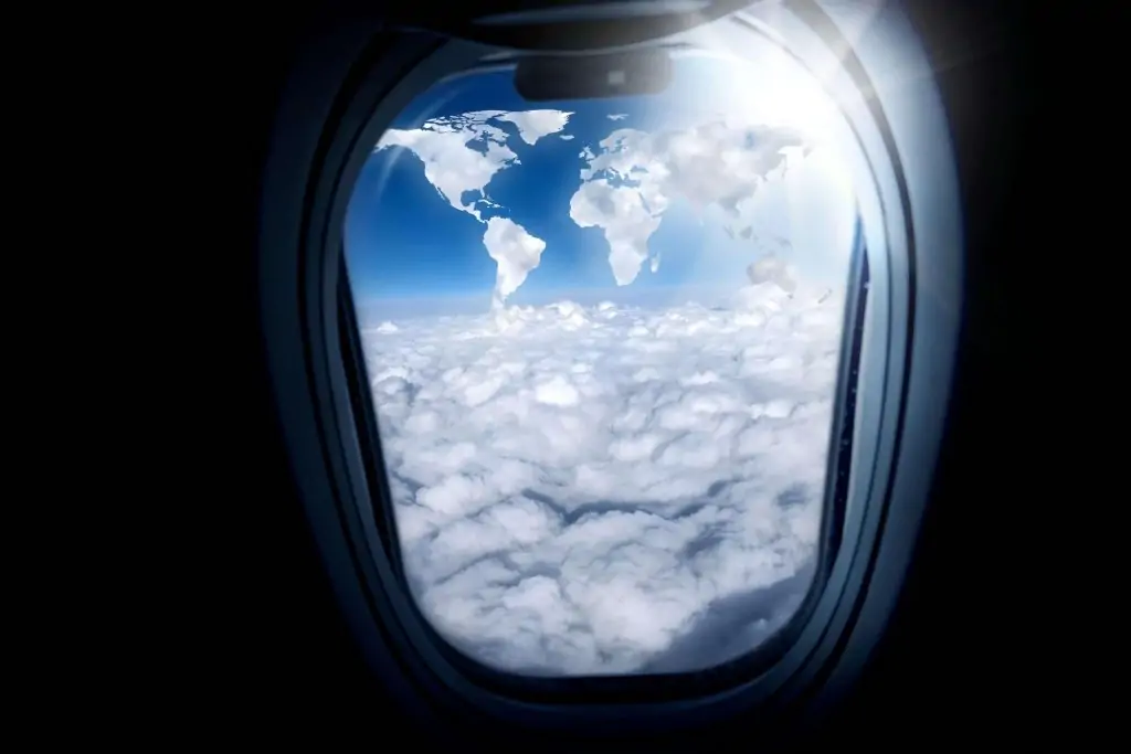 the private jet's window to witness clouds resembling a globe, offering a mesmerizing glimpse of Earth's beauty from the sky