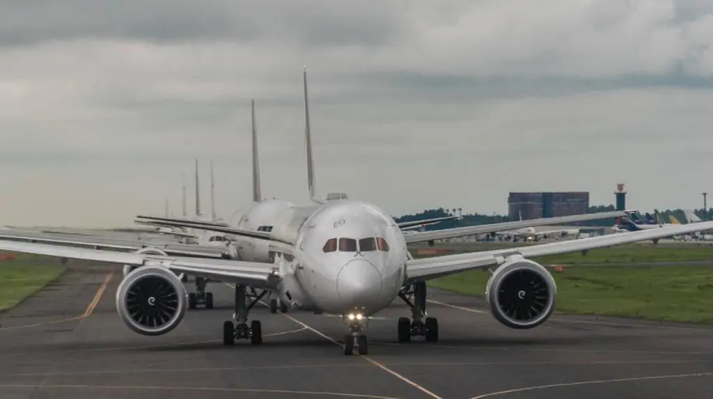 A mesmerizing aerial view of Sky N Jet's commercial aircraft fleet lined up for takeoff.